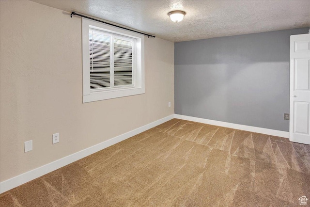 5772 Oakwood Dr, South Ogden, UT 84405 - carpeted spare room with a textured ceiling and baseboards