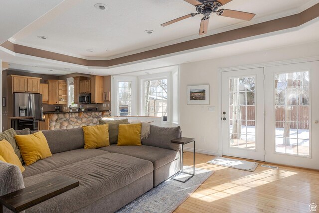 161 W Swiss Farm Way Unit 9, Midway, UT 84049 - living area featuring visible vents, light wood finished floors, baseboards, crown molding, and a raised ceiling