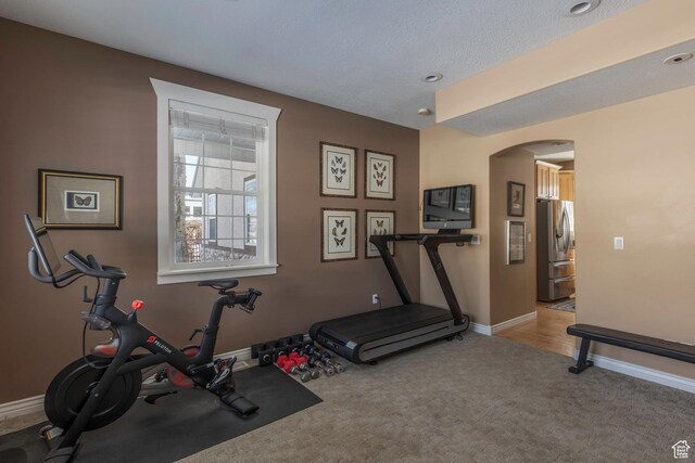 161 W Swiss Farm Way Unit 9, Midway, UT 84049 - exercise room with carpet, arched walkways, and baseboards