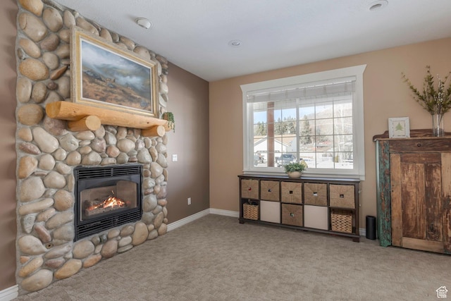 161 W Swiss Farm Way Unit 9, Midway, UT 84049 - unfurnished living room with baseboards, a fireplace, and carpet flooring