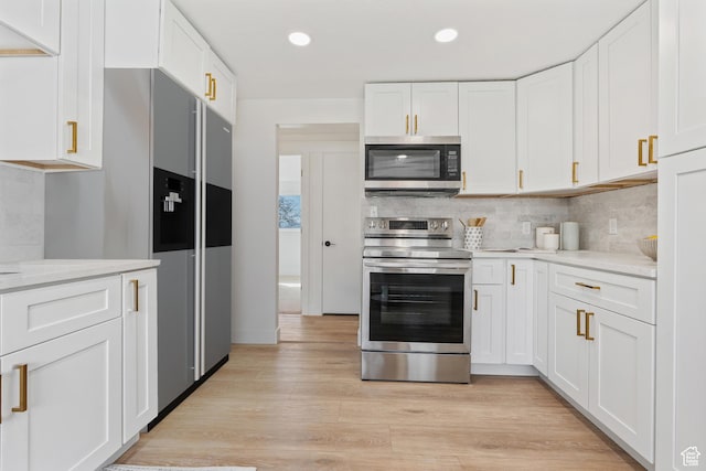 4375 S 2700 E, Holladay, UT 84124 - kitchen featuring light wood-style flooring, recessed lighting, white cabinets, appliances with stainless steel finishes, and tasteful backsplash