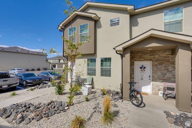 498 W 1225 N Unit 28, Cedar City, UT 84721 - view of front of property with stone siding, stucco siding, and uncovered parking