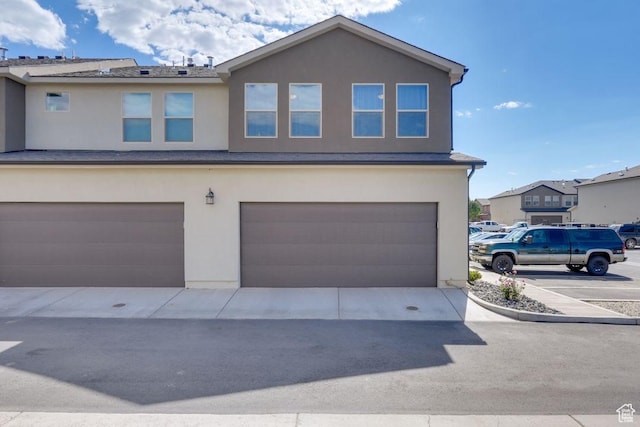 498 W 1225 N Unit 28, Cedar City, UT 84721 - view of front of house featuring an attached garage and stucco siding