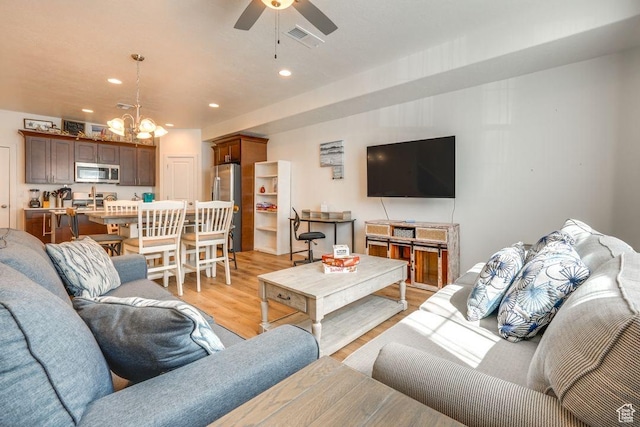 498 W 1225 N Unit 28, Cedar City, UT 84721 - living area with visible vents, recessed lighting, ceiling fan with notable chandelier, and light wood-type flooring