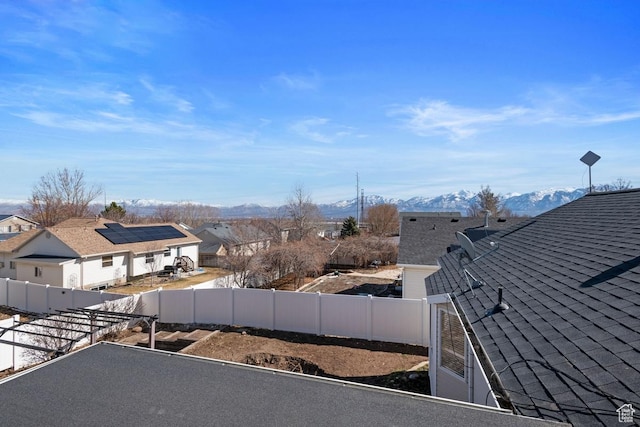 5964 W Jackling Way, West Jordan, UT 84081 - exterior space with a residential view, a mountain view, a fenced backyard, and roof with shingles