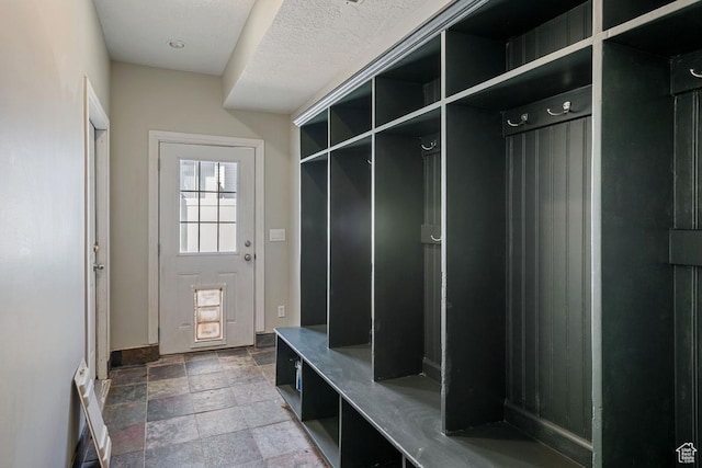 5964 W Jackling Way, West Jordan, UT 84081 - mudroom with baseboards and stone tile flooring