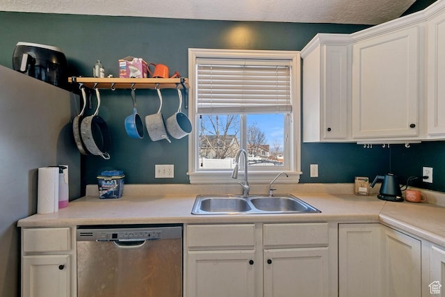 5964 W Jackling Way, West Jordan, UT 84081 - kitchen featuring stainless steel dishwasher, light countertops, white cabinetry, and a sink