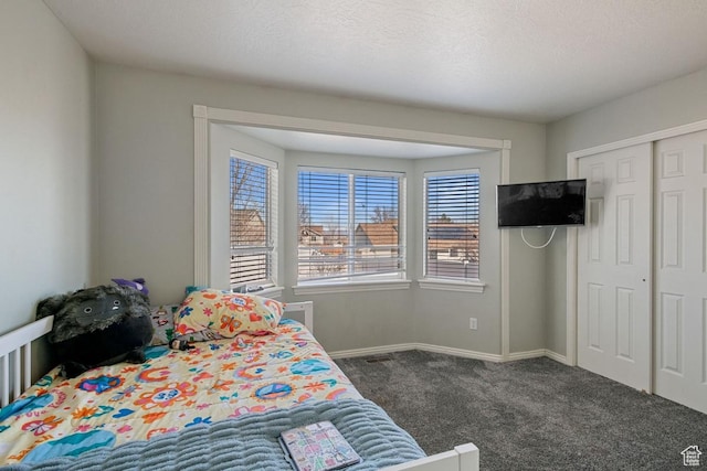 5964 W Jackling Way, West Jordan, UT 84081 - bedroom with a closet, baseboards, a textured ceiling, and carpet flooring