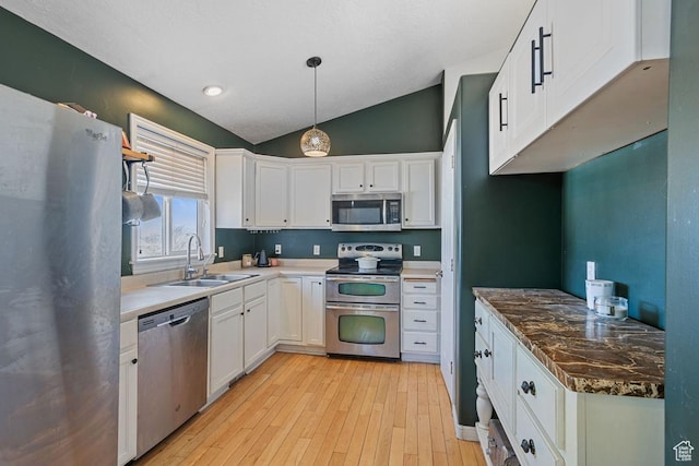 5964 W Jackling Way, West Jordan, UT 84081 - kitchen featuring a sink, light wood-type flooring, appliances with stainless steel finishes, and white cabinets