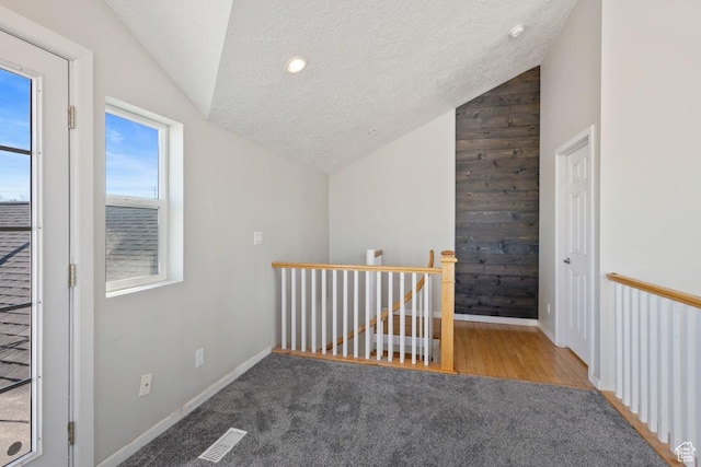 5964 W Jackling Way, West Jordan, UT 84081 - bonus room with visible vents, lofted ceiling, a textured ceiling, and baseboards
