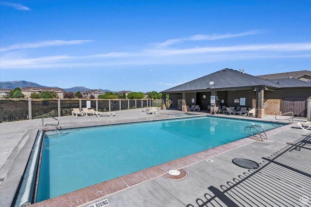 3635 E Clear Rock Rd Unit 4, Eagle Mountain, UT 84005 - pool featuring a patio area, a mountain view, and fence