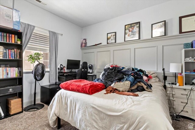 3635 E Clear Rock Rd Unit 4, Eagle Mountain, UT 84005 - bedroom with visible vents, carpet floors, and a decorative wall