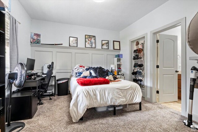 3635 E Clear Rock Rd Unit 4, Eagle Mountain, UT 84005 - bedroom with carpet flooring and a decorative wall