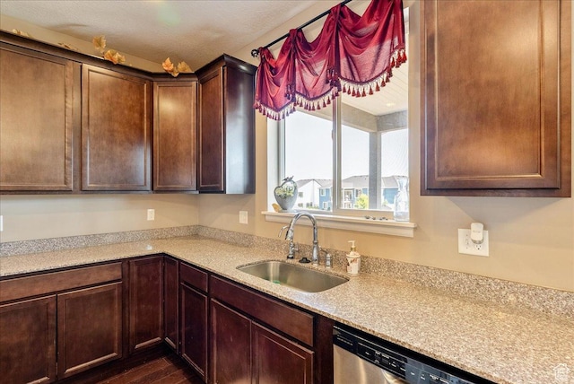 5663 W Yukon Park Ln S, Herriman, UT 84096 - kitchen with a sink, dishwasher, light countertops, and dark wood finished floors