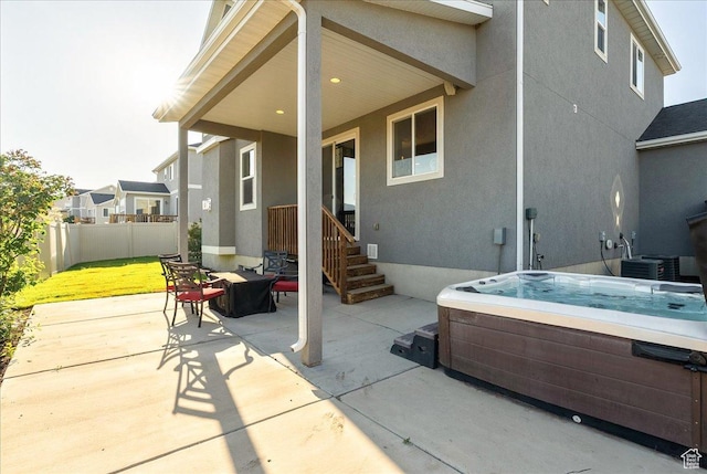 5663 W Yukon Park Ln S, Herriman, UT 84096 - view of patio with a hot tub and central AC unit