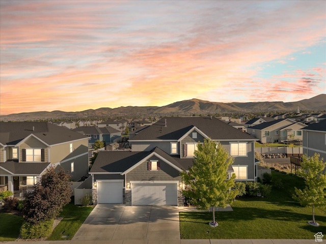 5663 W Yukon Park Ln S, Herriman, UT 84096 - traditional home featuring a residential view, driveway, a mountain view, and stone siding