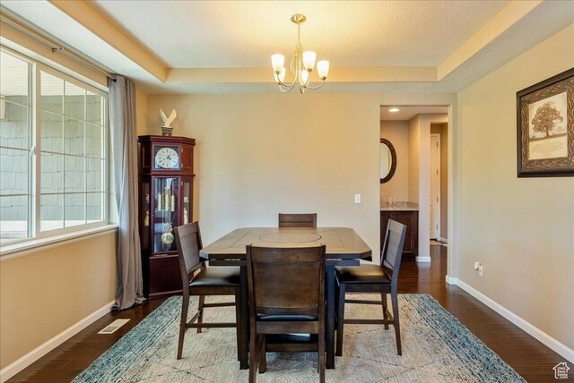 5663 W Yukon Park Ln S, Herriman, UT 84096 - dining area with a chandelier, plenty of natural light, baseboards, and wood finished floors