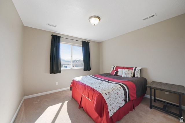 bedroom with carpet flooring, visible vents, and baseboards