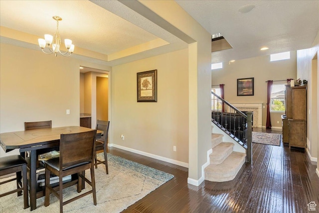 5663 W Yukon Park Ln S, Herriman, UT 84096 - dining area with baseboards, a chandelier, wood-type flooring, stairs, and recessed lighting