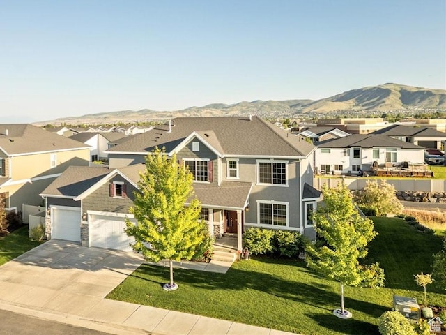 5663 W Yukon Park Ln S, Herriman, UT 84096 - view of front facade featuring a residential view, driveway, a mountain view, and a front lawn