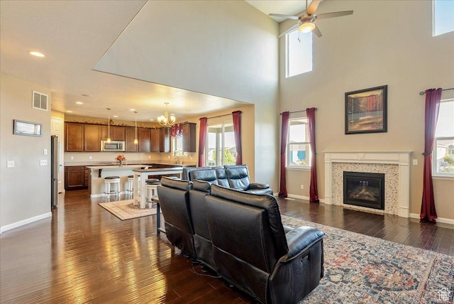 5663 W Yukon Park Ln S, Herriman, UT 84096 - living area with a chandelier, dark wood-type flooring, ceiling fan, baseboards, and recessed lighting