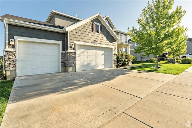 5663 W Yukon Park Ln S, Herriman, UT 84096 - craftsman inspired home with stone siding, concrete driveway, a garage, and a front yard