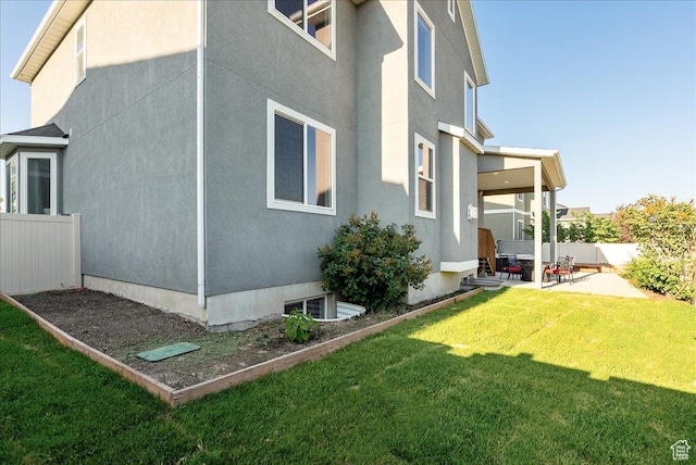 5663 W Yukon Park Ln S, Herriman, UT 84096 - view of property exterior with a patio and stucco siding