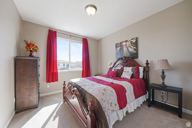 carpeted bedroom featuring baseboards