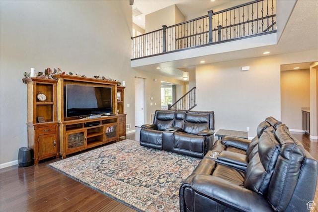 5663 W Yukon Park Ln S, Herriman, UT 84096 - living area featuring baseboards, dark wood finished floors, a high ceiling, recessed lighting, and stairway