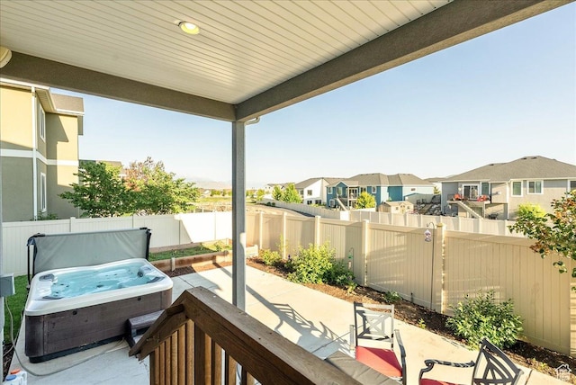 5663 W Yukon Park Ln S, Herriman, UT 84096 - fenced backyard with a hot tub, a residential view, and a patio