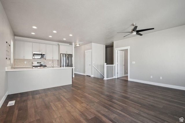 1722 W Shade Ln, Riverton, UT 84065 - kitchen featuring stainless steel appliances, dark wood-type flooring, a peninsula, and open floor plan