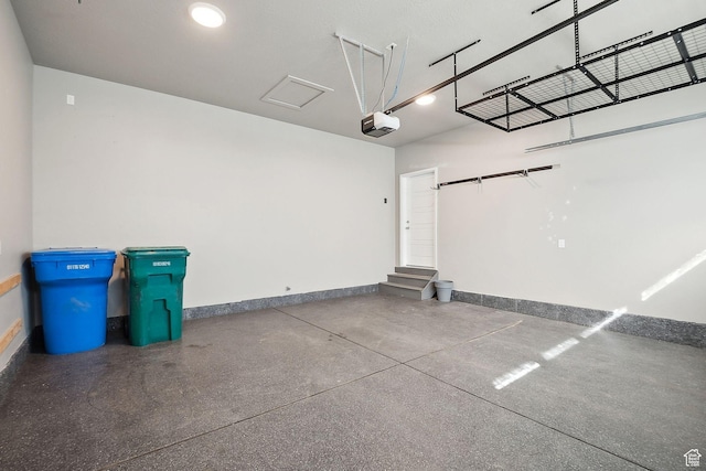 1722 W Shade Ln, Riverton, UT 84065 - garage featuring a garage door opener and baseboards
