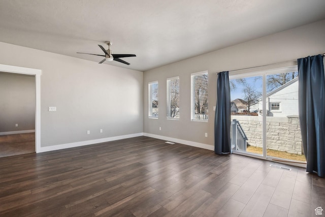 1722 W Shade Ln, Riverton, UT 84065 - unfurnished room featuring a ceiling fan, baseboards, visible vents, and dark wood-style flooring