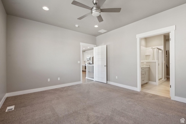 1722 W Shade Ln, Riverton, UT 84065 - unfurnished bedroom with visible vents, recessed lighting, connected bathroom, baseboards, and light colored carpet