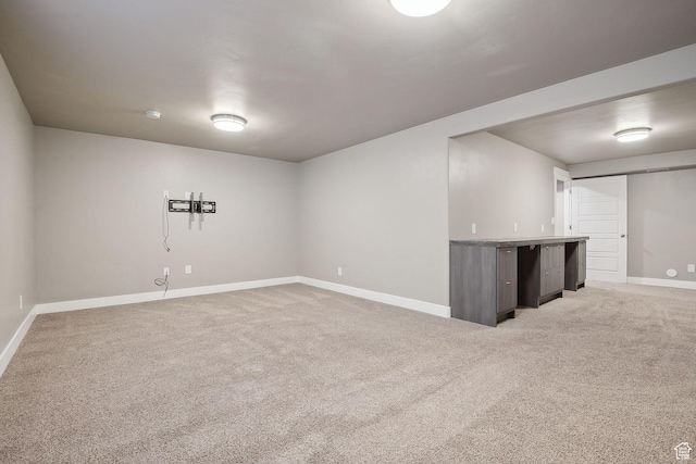 1722 W Shade Ln, Riverton, UT 84065 - finished basement featuring baseboards, light carpet, and bar area