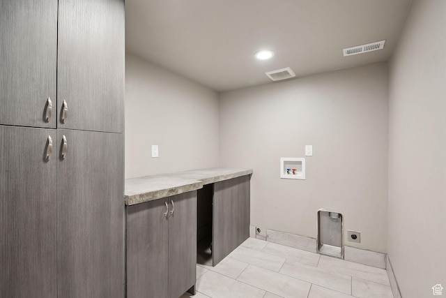1722 W Shade Ln, Riverton, UT 84065 - clothes washing area with electric dryer hookup, visible vents, cabinet space, and washer hookup