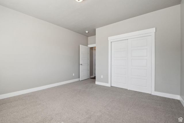 1722 W Shade Ln, Riverton, UT 84065 - unfurnished bedroom with a closet, carpet flooring, and baseboards