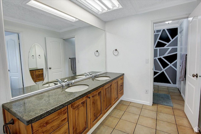6464 Bybee Dr, Ogden, UT 84403 - bathroom featuring a textured ceiling, tile patterned floors, double vanity, and a sink