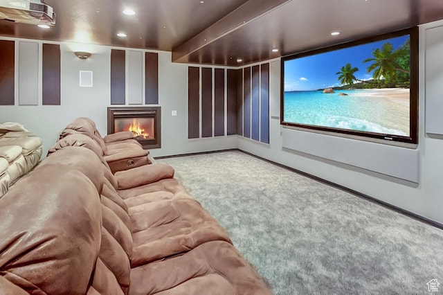6464 Bybee Dr, Ogden, UT 84403 - home theater room with recessed lighting, carpet floors, and a glass covered fireplace