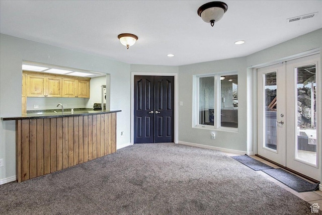 6464 Bybee Dr, Ogden, UT 84403 - kitchen with dark countertops, visible vents, baseboards, carpet floors, and french doors