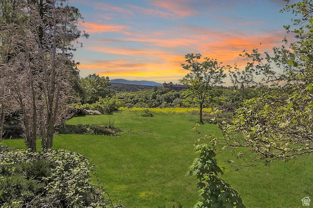 6464 Bybee Dr, Ogden, UT 84403 - yard at dusk featuring a mountain view