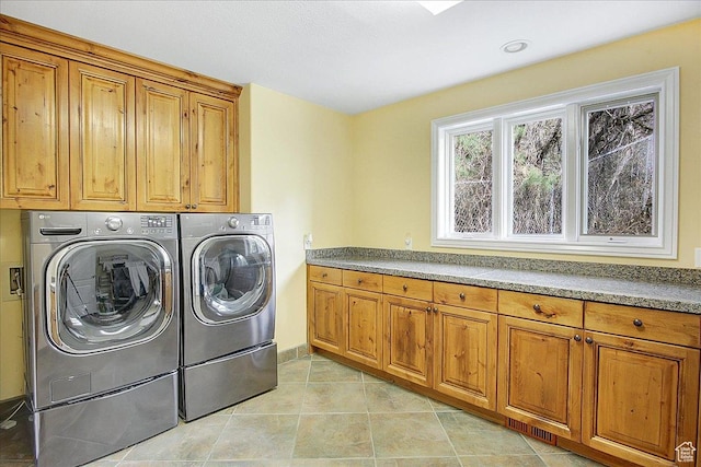 6464 Bybee Dr, Ogden, UT 84403 - washroom with light tile patterned floors, cabinet space, and washing machine and clothes dryer