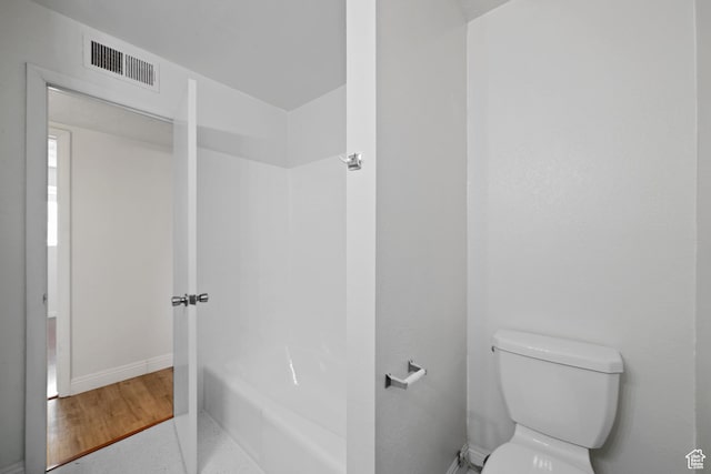 bathroom featuring visible vents, toilet, shower / bathtub combination, and baseboards