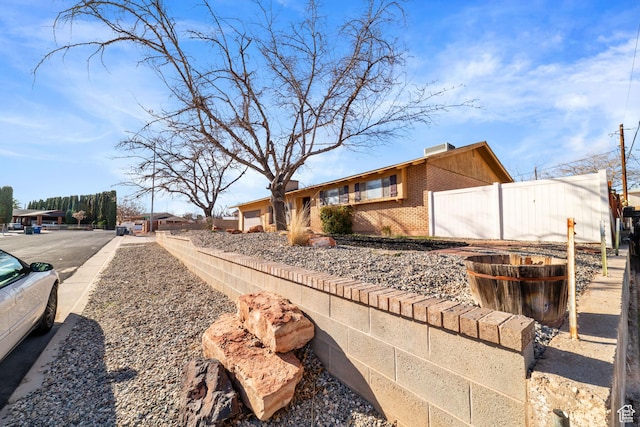 exterior space with brick siding