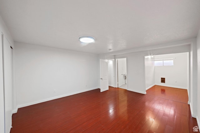 interior space featuring wood finished floors and baseboards