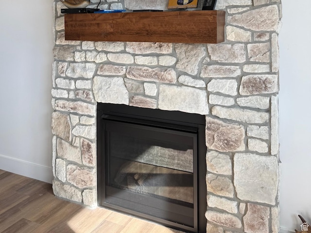 13342 N 10800 W Unit 7, Tremonton, UT 84337 - details featuring baseboards, a glass covered fireplace, and wood finished floors