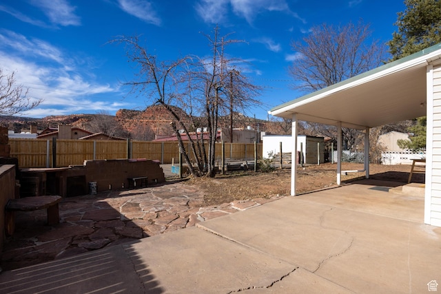 311 N 300 W, Kanab, UT 84741 - view of patio featuring fence and an outdoor structure