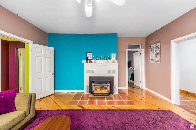 311 N 300 W, Kanab, UT 84741 - living area with baseboards, hardwood / wood-style flooring, visible vents, and a ceiling fan