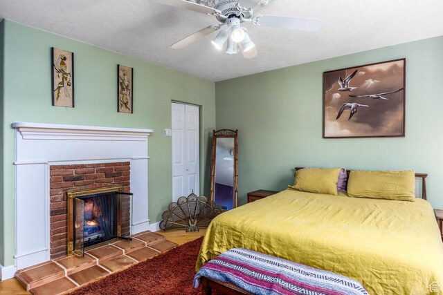 311 N 300 W, Kanab, UT 84741 - bedroom with a ceiling fan, baseboards, a fireplace, and a closet