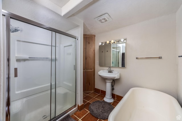 311 N 300 W, Kanab, UT 84741 - bathroom featuring a sink, a freestanding bath, a stall shower, visible vents, and tile patterned flooring